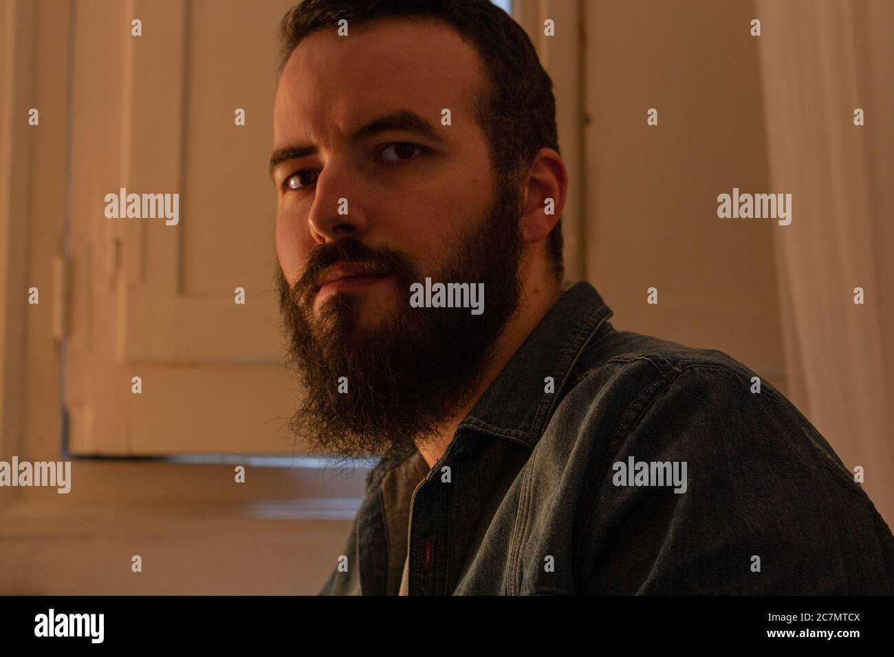 Bearded beautiful male looking at the camera Stock Photo