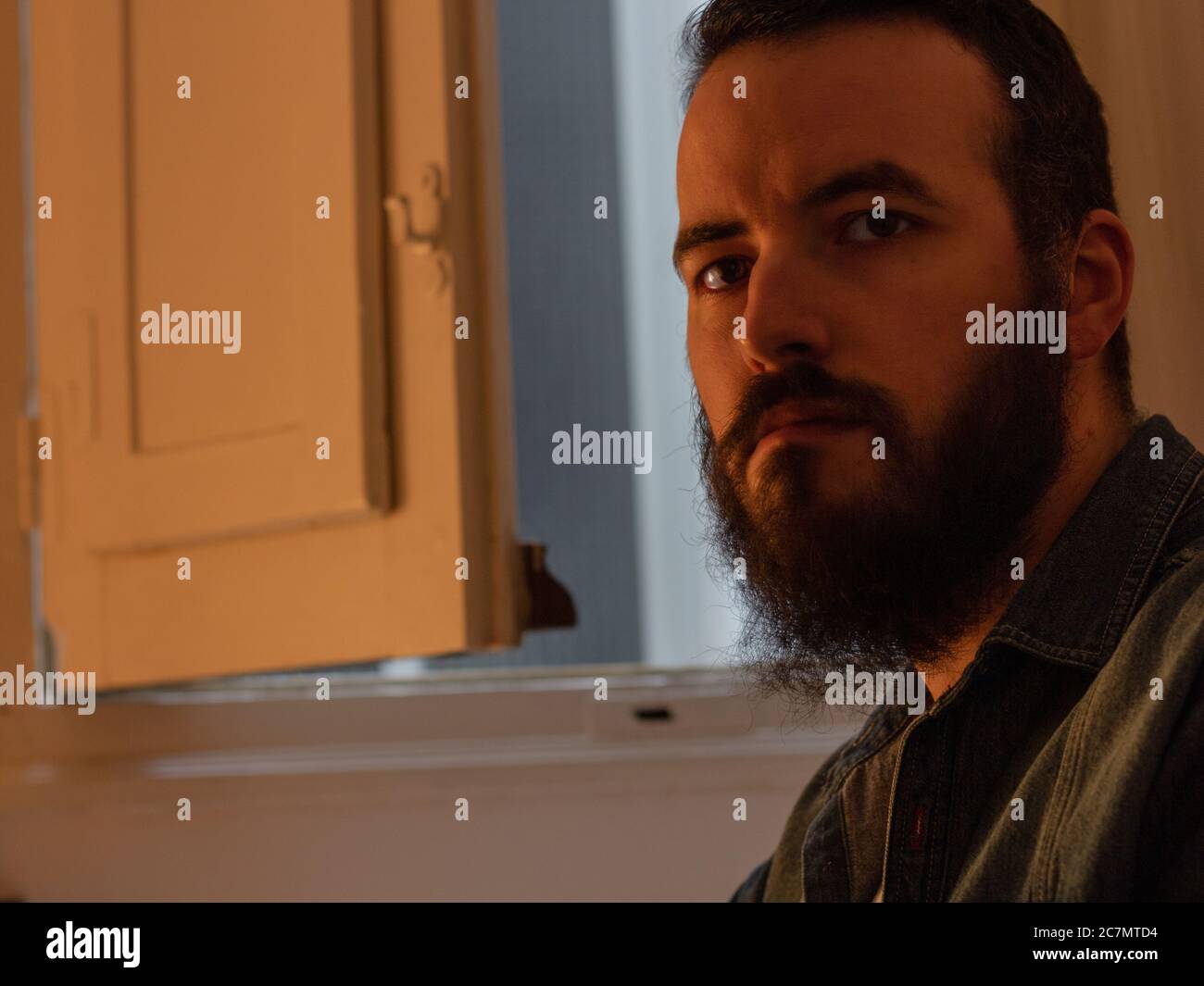Bearded attractive male looking at the camera Stock Photo