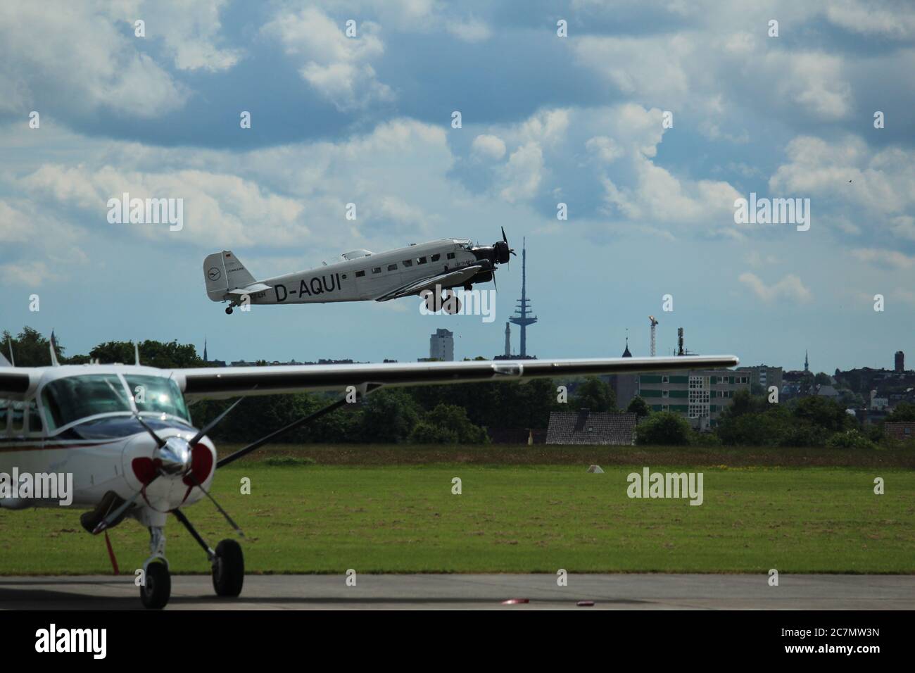 Historical Lufthansa Junkers Ju 52/3m (D-AQUI / D-CDLH) takes off at Kiel-Holtenau airport for a touristic flight over the city Stock Photo
