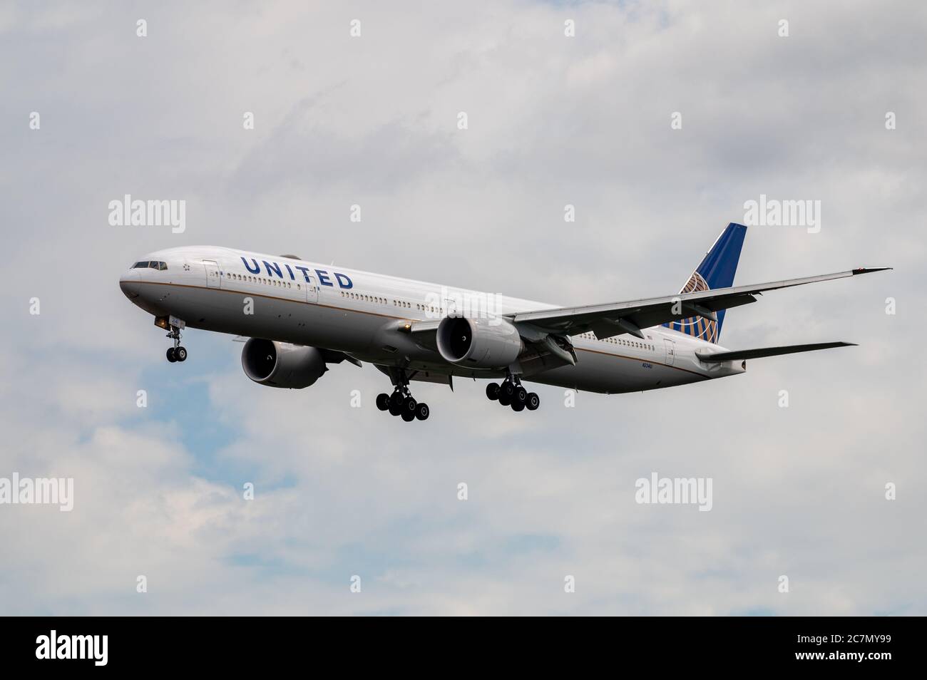 Boeing 777-300 N2341U in the colours of United Airlines in landing configuration on approach to Frankfurt airport, Germany Stock Photo