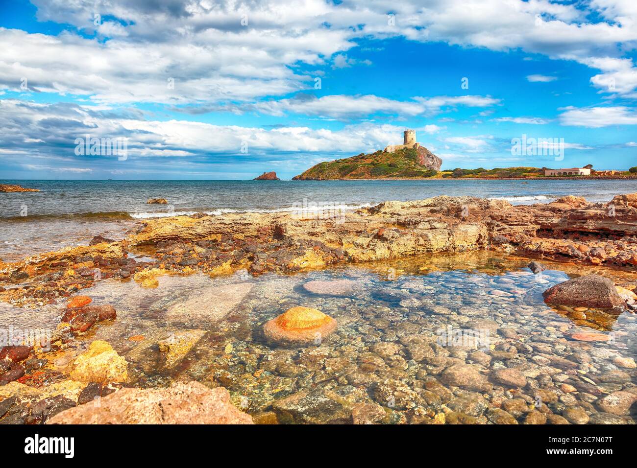 Ancient Spanish tower of Coltellazzo of Saint Efisio lighthouse at Nora archeological site . Location:  Nora, Pula, Sardinia, Italy Europe Stock Photo