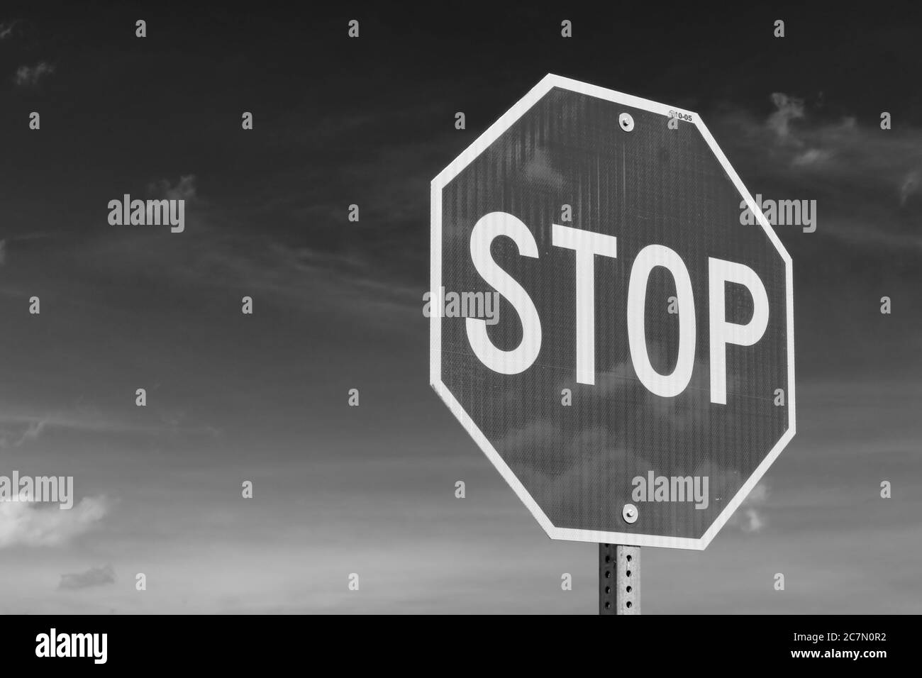 Stop sign with blue sky, black and white Stock Photo