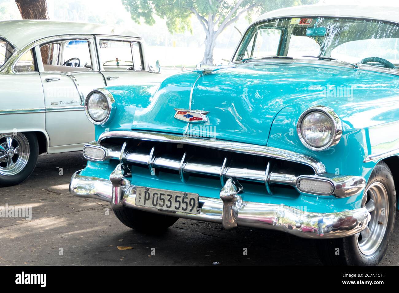 Up close view of a teal colored classic Cuban car. Featuring the front grill. Stock Photo