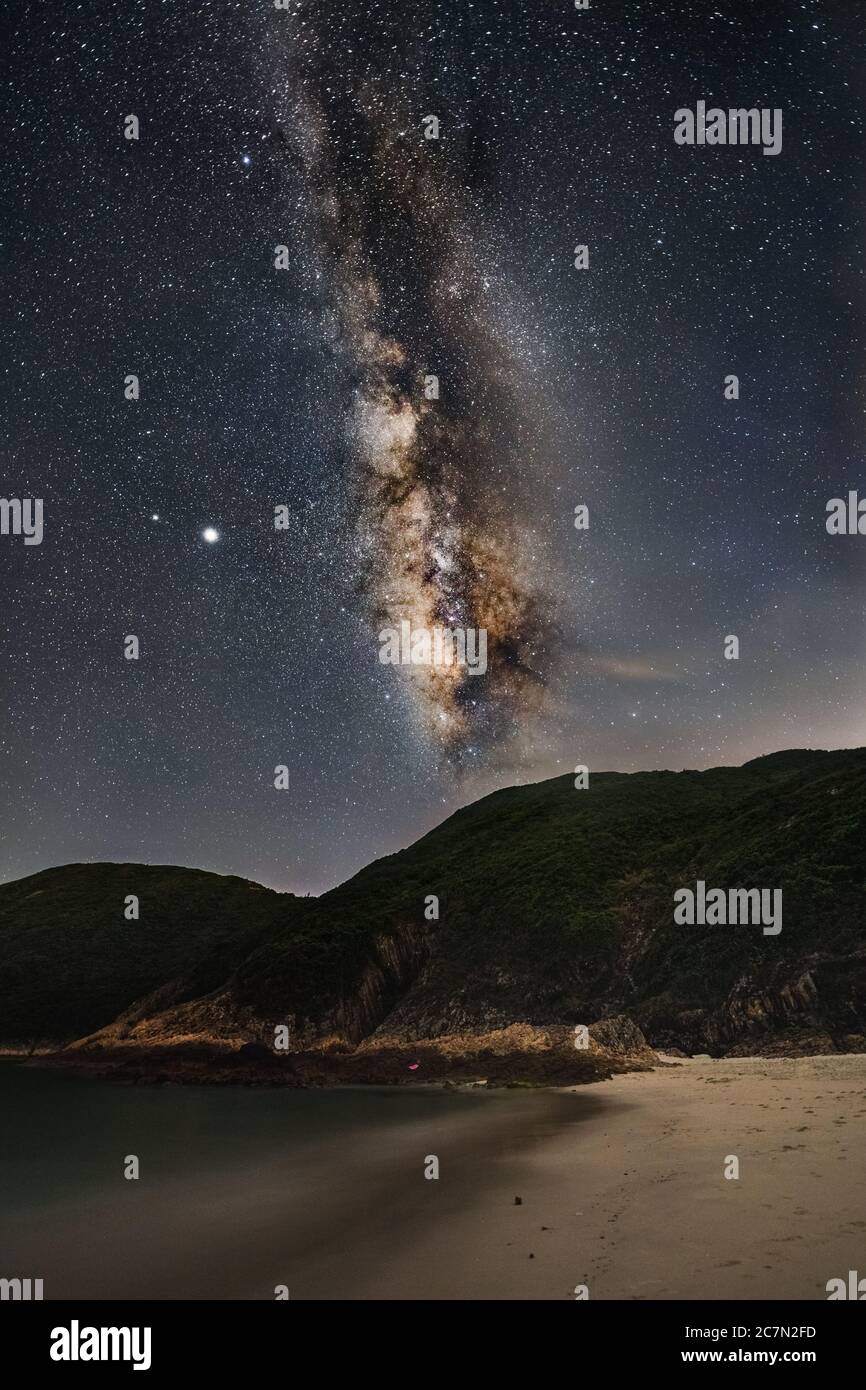 Beautiful scenery of Milky Way Galaxy in the night sky over a landscape ...