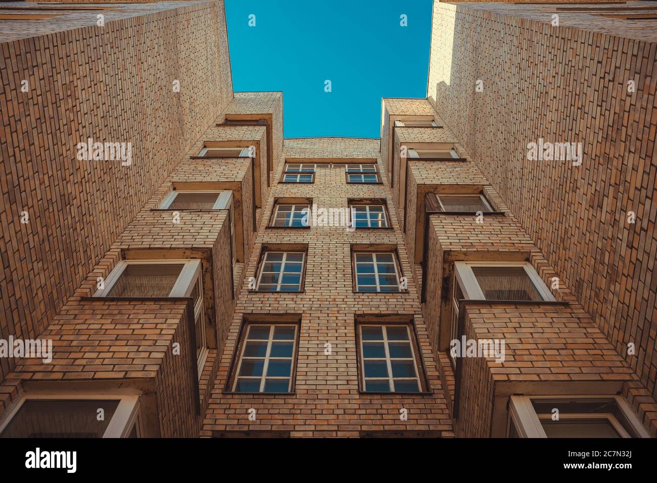 Low angle shot of a tall building under the blue sky Stock Photo - Alamy