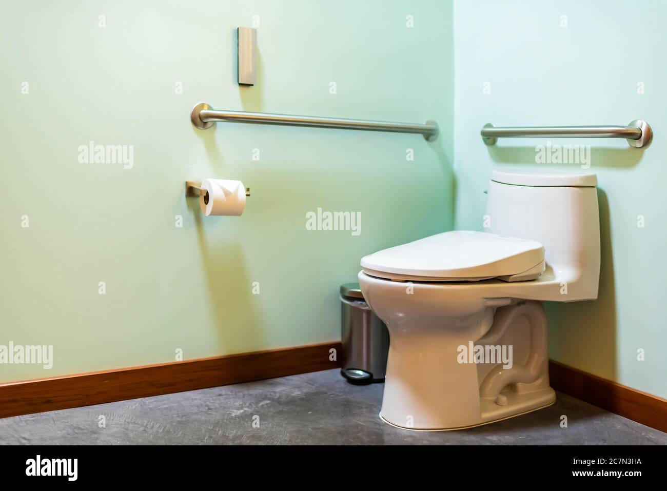 Modern handicapped accessible clean bathroom interior with Japanese modern toilet restroom green