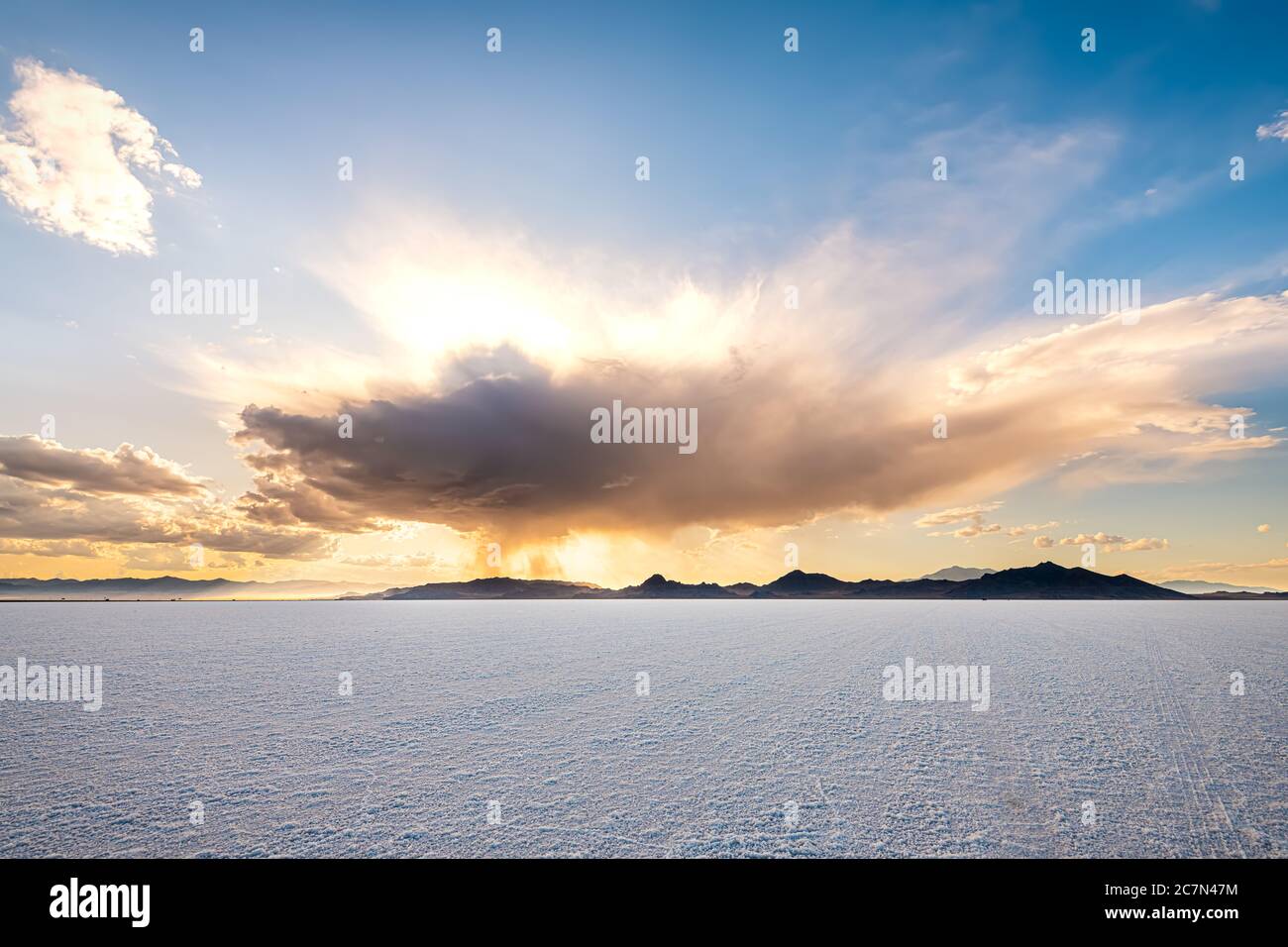 Bonneville Salt Flats wide angle view of storm clouds at sunset near Salt Lake City, Utah and mountain view with nobody open landscape Stock Photo