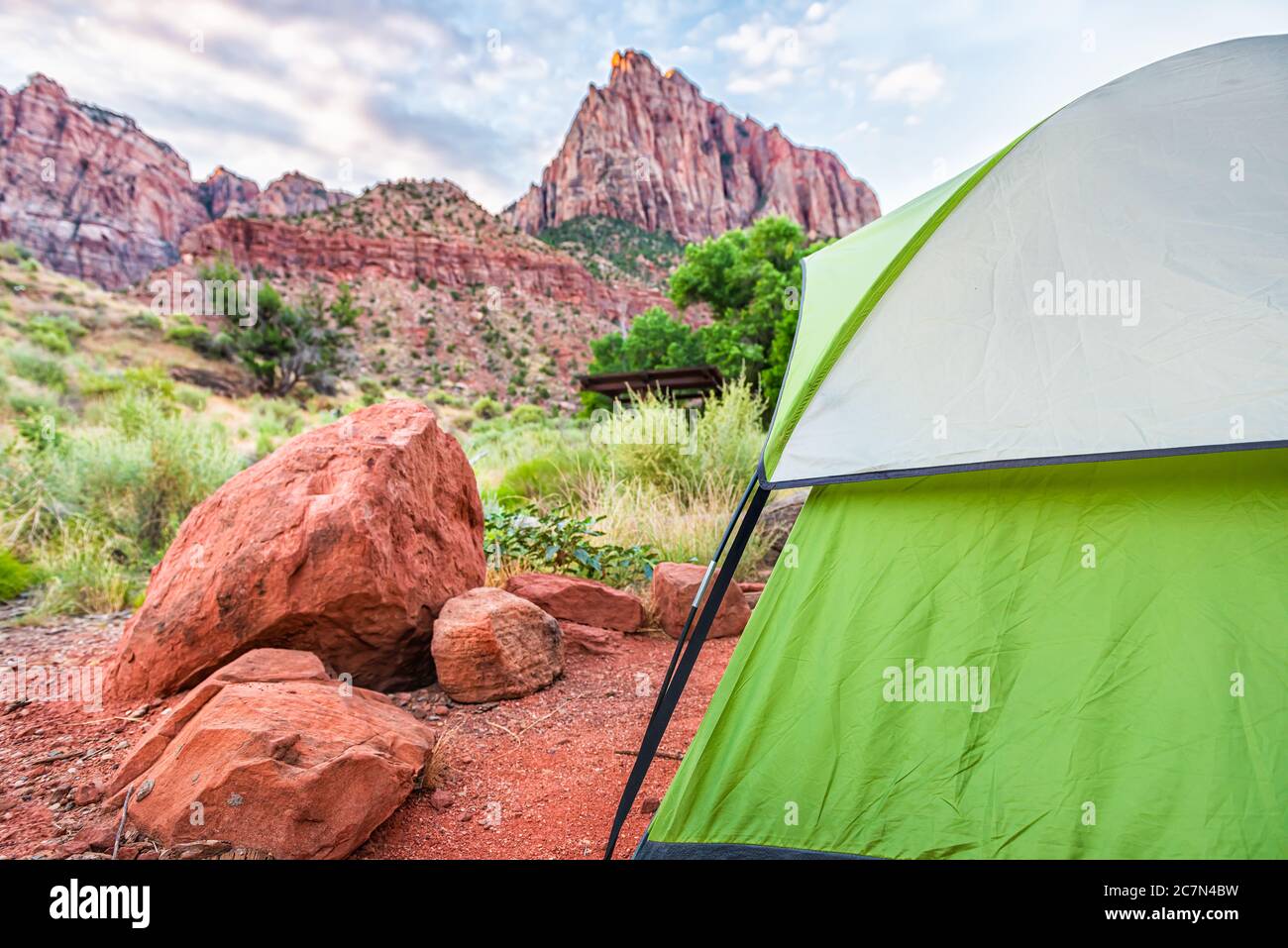Zion National Park in Utah with tent closeup on camp site at Watchman Campground by rocks and view of cliffs Stock Photo
