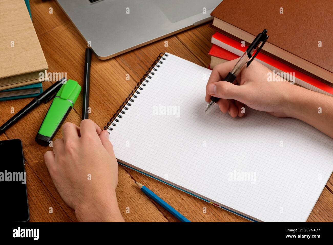 Worker writing in a notepad, making notes or summary Stock Photo Alamy