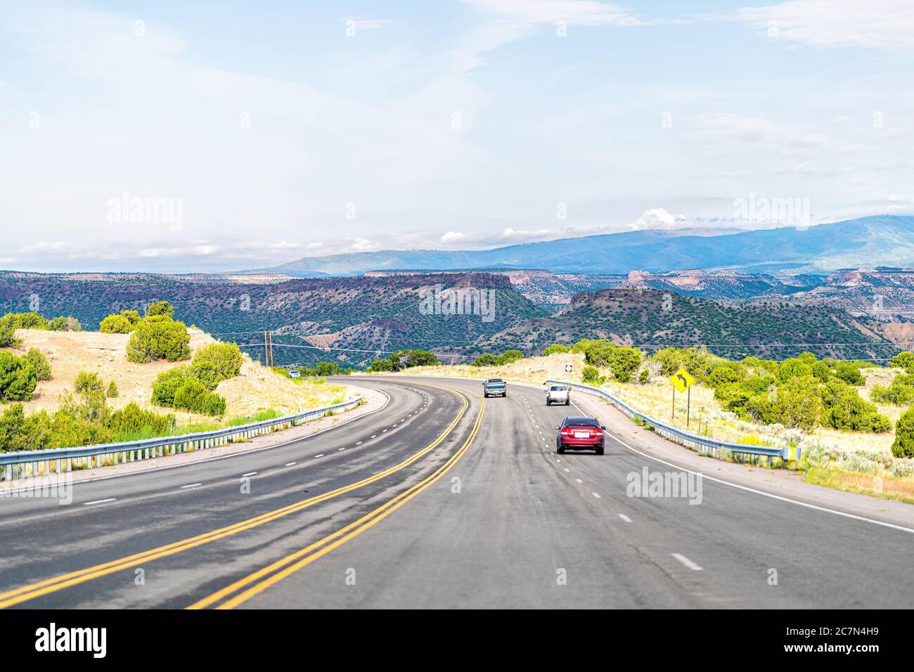 Santa Fe county, New Mexico desert with cars on road highway to Los Alamos driving on street 502 west Stock Photo