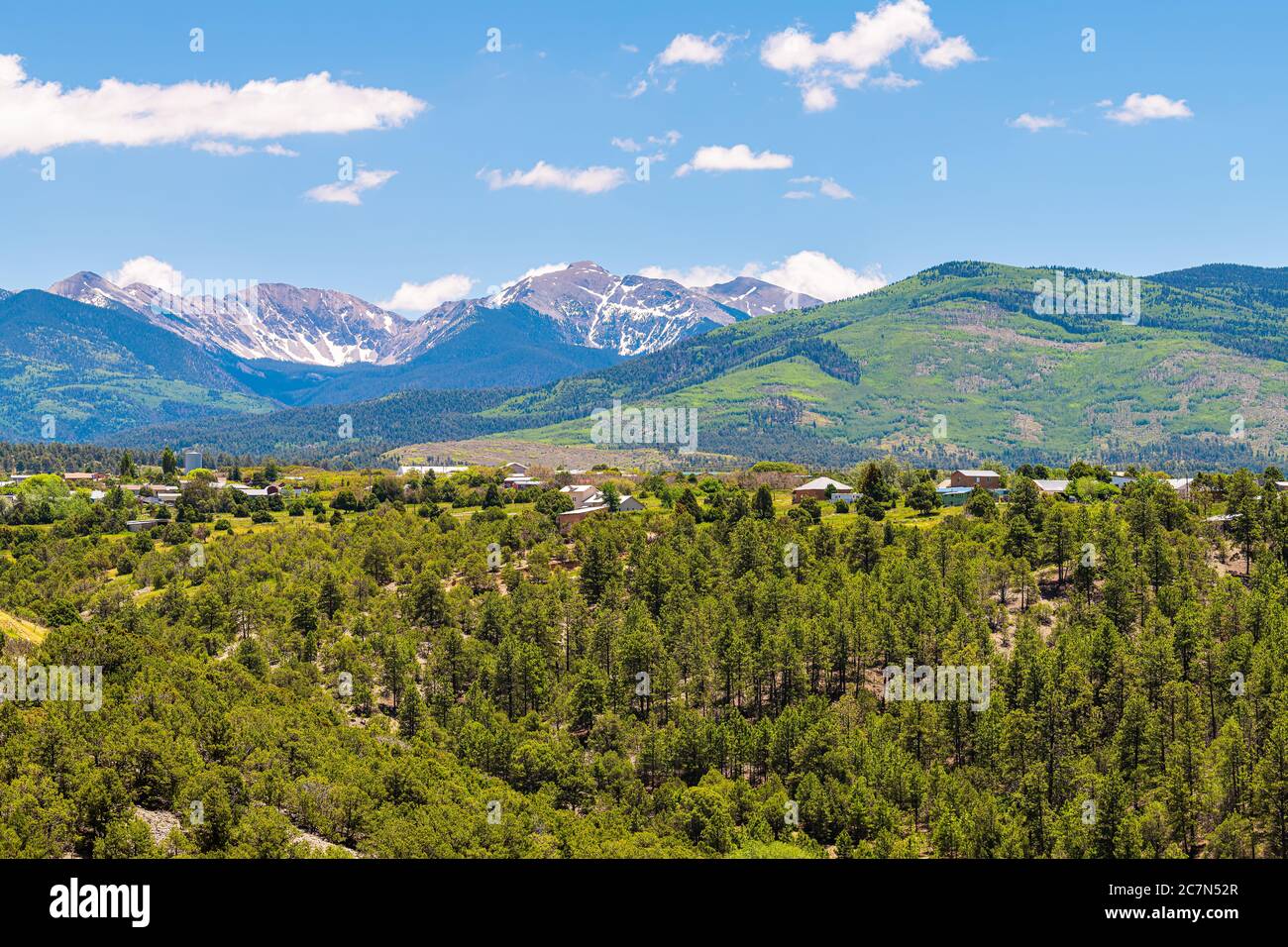 Landscape high angle panoramic cityscape view during summer from High Road to Taos of mountains and village called Truchas in New Mexico, USA Stock Photo