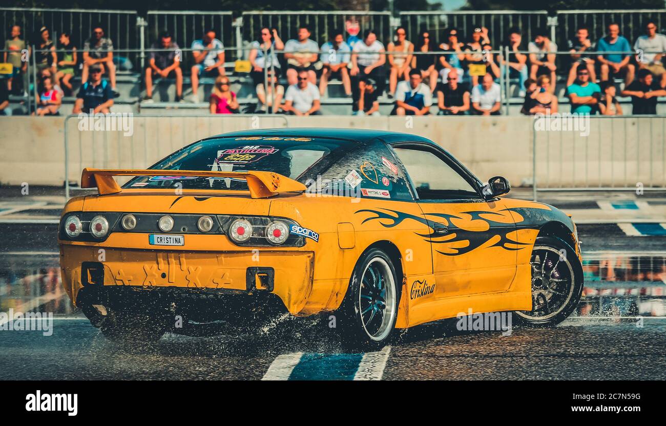 Milan, Italy, June 03, 2018:yellow Nissan racing car performs during the 1st Drift Show Il Destriero at the Iper Drive in Milan. Stock Photo