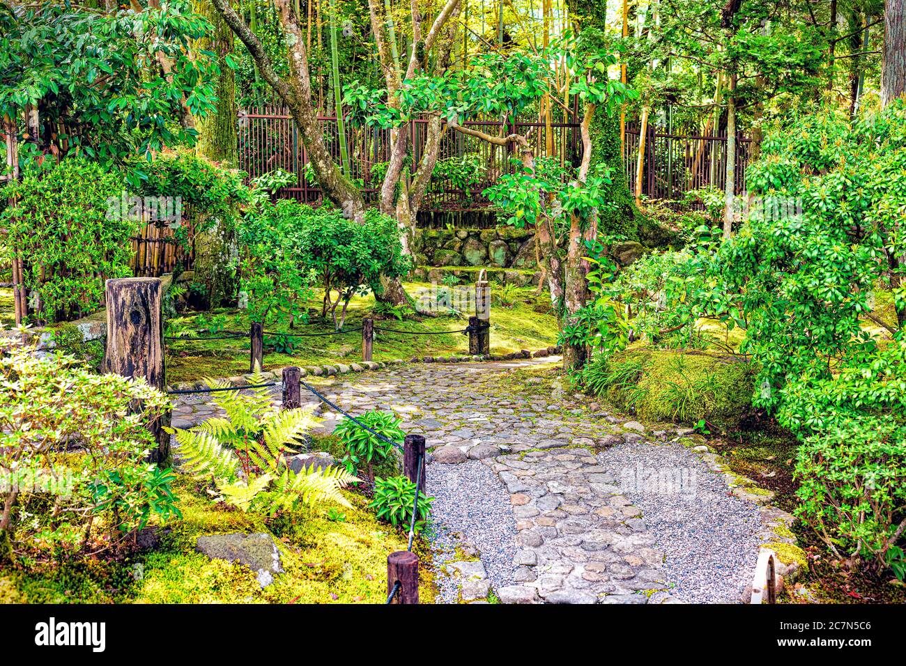 Nara, Japan traditional moss Yoshikien garden during spring with old stone path road landscape in Japanese style Stock Photo
