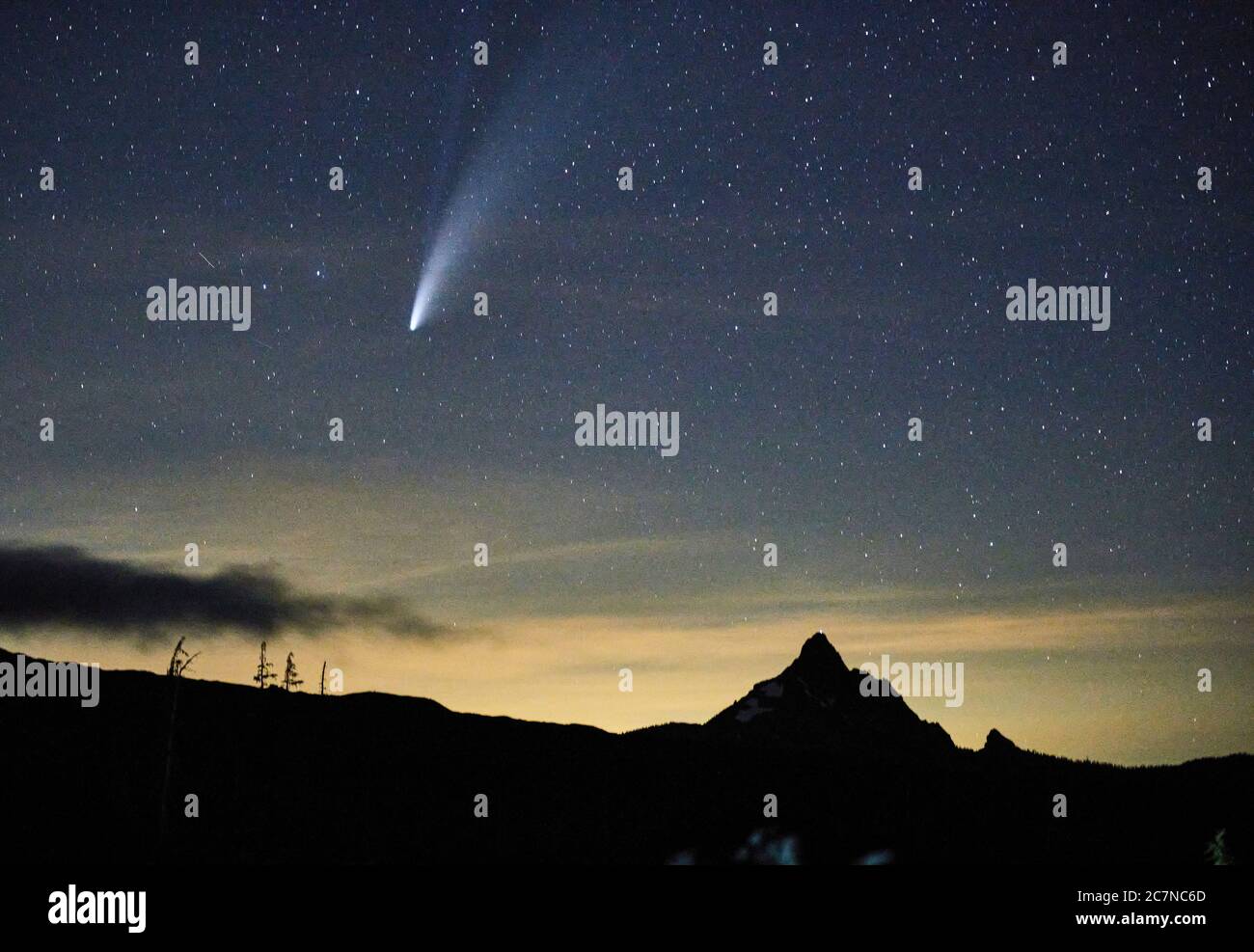 Comet Neowise appears in the night sky over Oregon's Mount Washington on July 17, 2020. Stock Photo