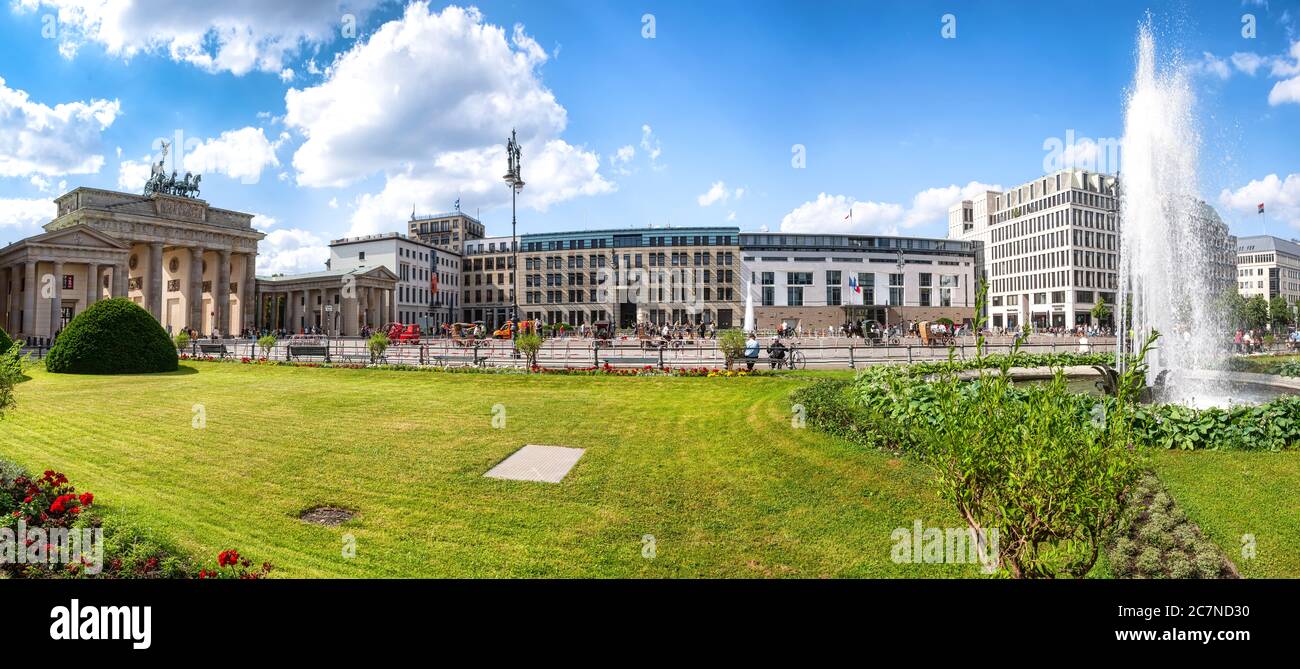 Berlin, Germany, 06/14/2020: Pariser Platz with Brandenburg Gate, French embassy and the academy of arts on a sunny day in summer, in foreground a fou Stock Photo