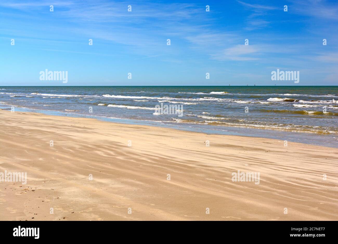 Waves and Sand on a Remote Beach on Padre Island National Seashore on the Gulf Coast of Texas Stock Photo