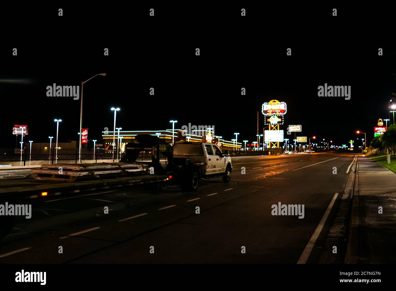 Wendover, USA - July 27, 2019: Nevada city near Utah border with Red Garter Casino on road at night illuminated neon lights and boulevard Stock Photo
