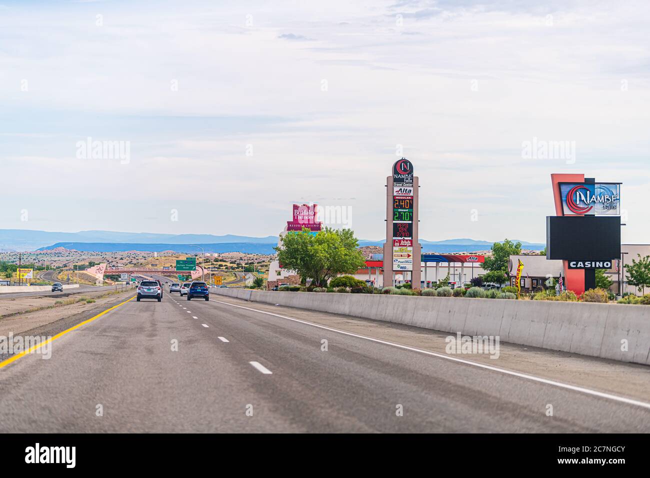 Frontage, USA - June 17, 2019: City near Santa Fe with gas station prices and Nambe Falls Casino gambling building by highway road 285 traffic and sig Stock Photo