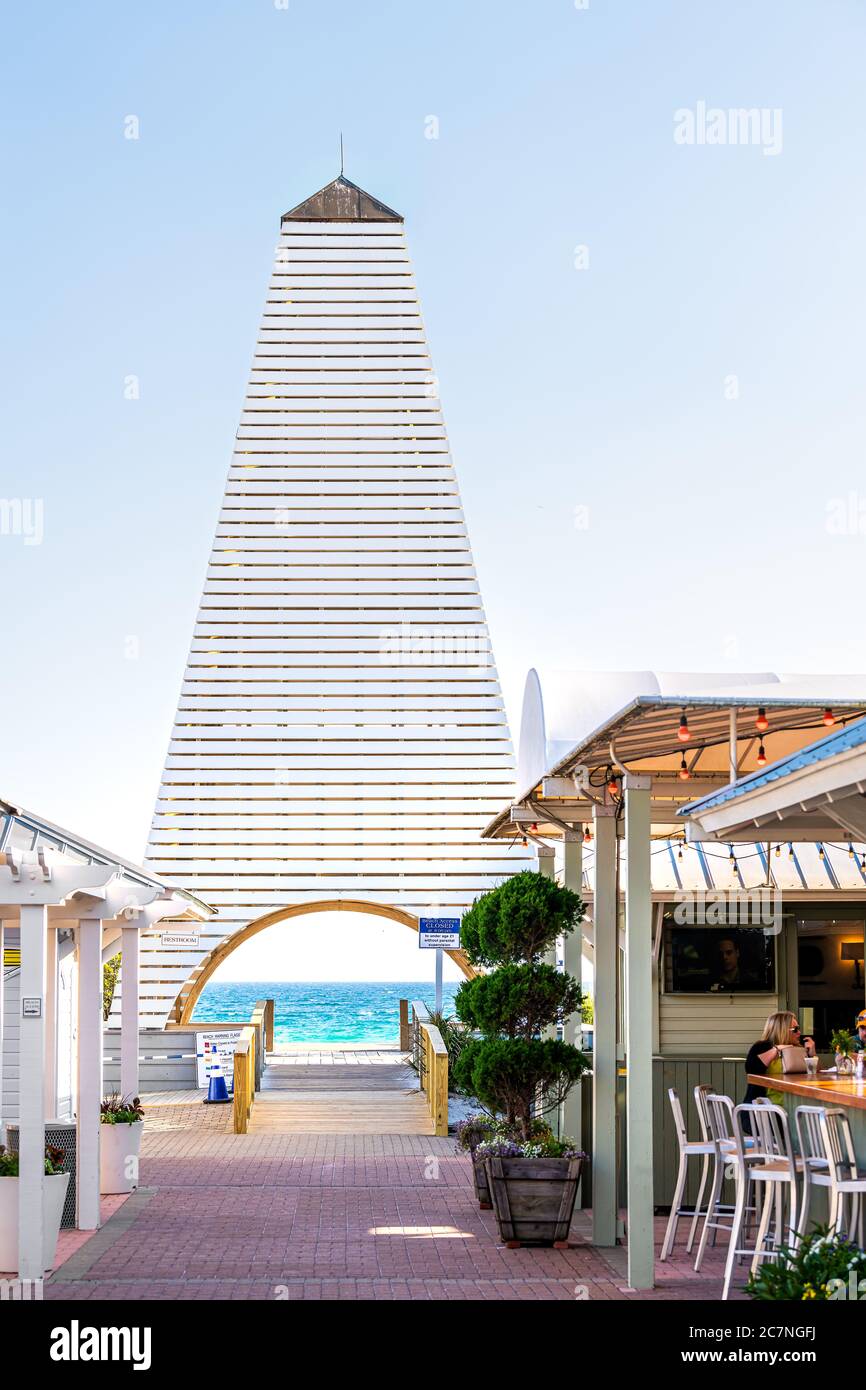 Seaside, USA - April 25, 2018: Park in famous city town beach village during sunny day in Florida panhandle with white architecture of Obe pavilion to Stock Photo