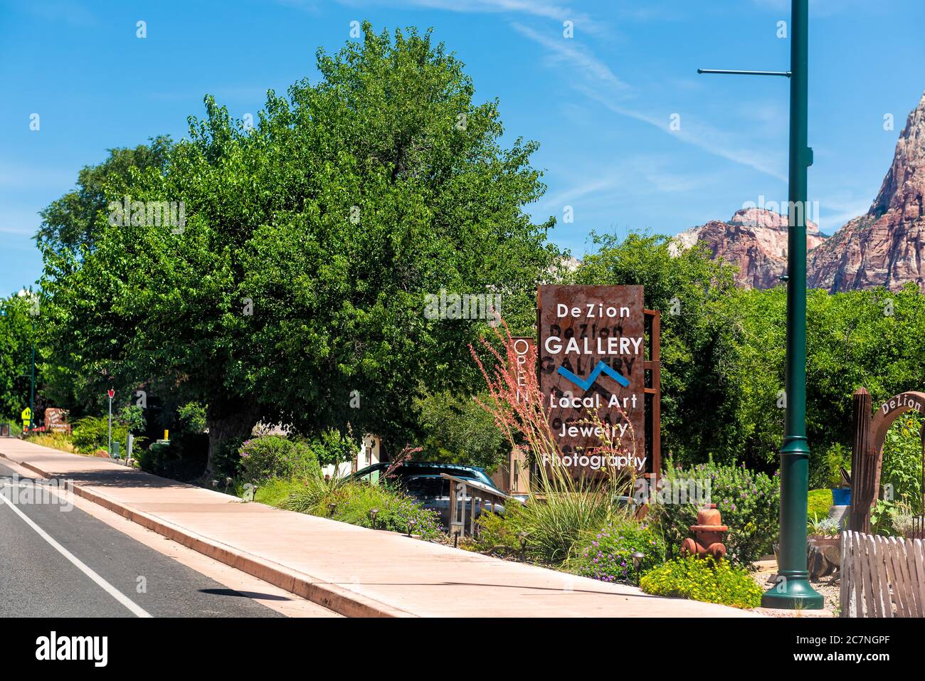 Springdale, USA - August 5, 2019: Zion National Park in Utah and town city road street with sign for DeZion Gallery art shop stores Stock Photo