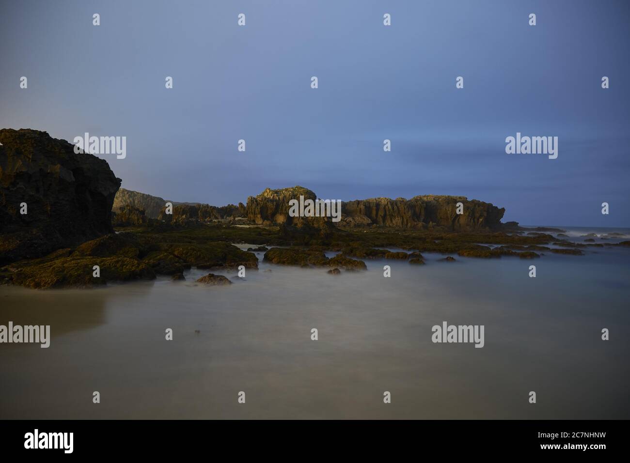 Playa Ris Beach with rocks in Playa de Ris, Noja, Spain Stock Photo - Alamy
