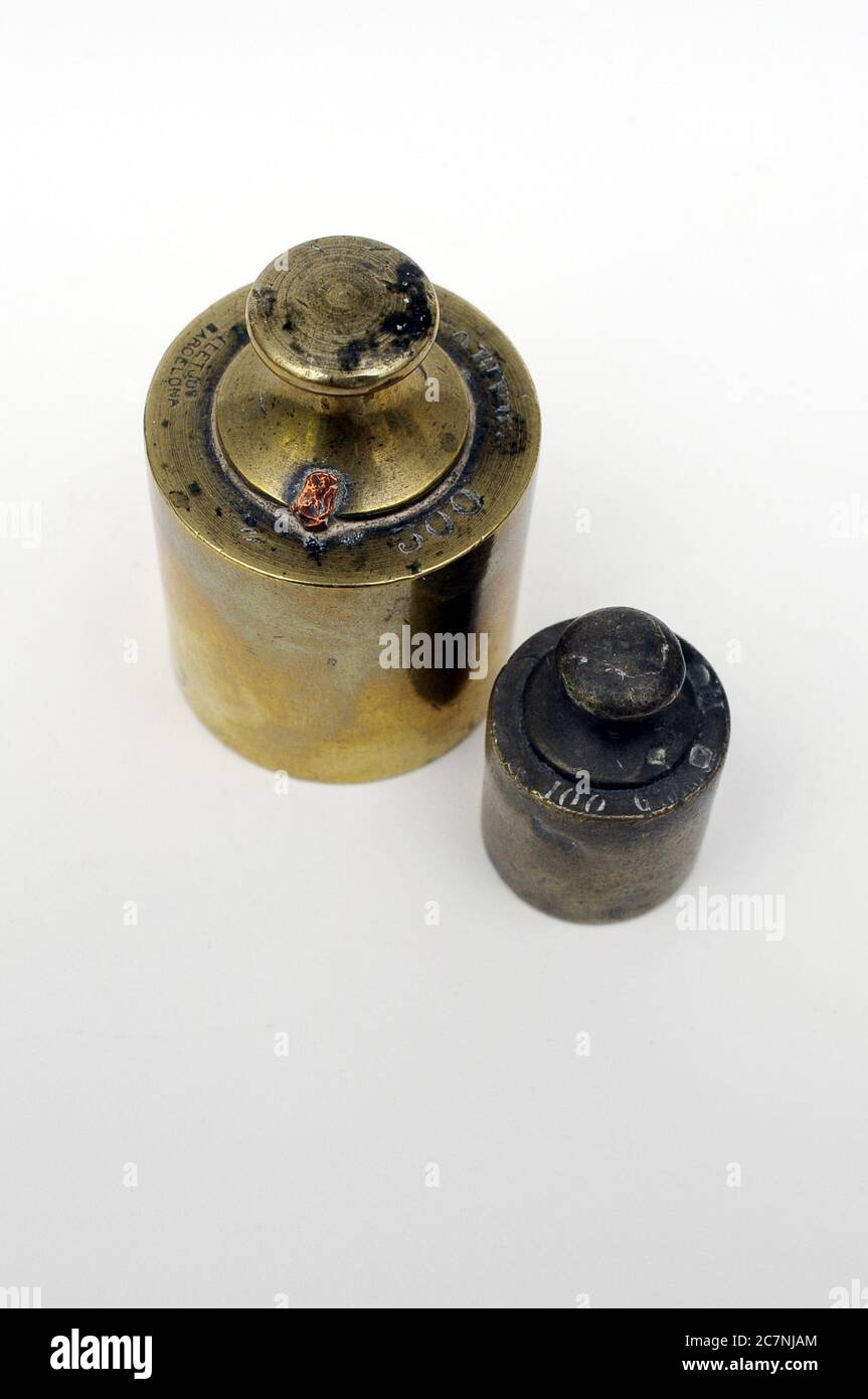 Weight for old scale, old weight, 1kg force, 500 gr, 500 grms, 1500kg with weights, weights with marks. weights, bronze weight, weight, strength, Stock Photo