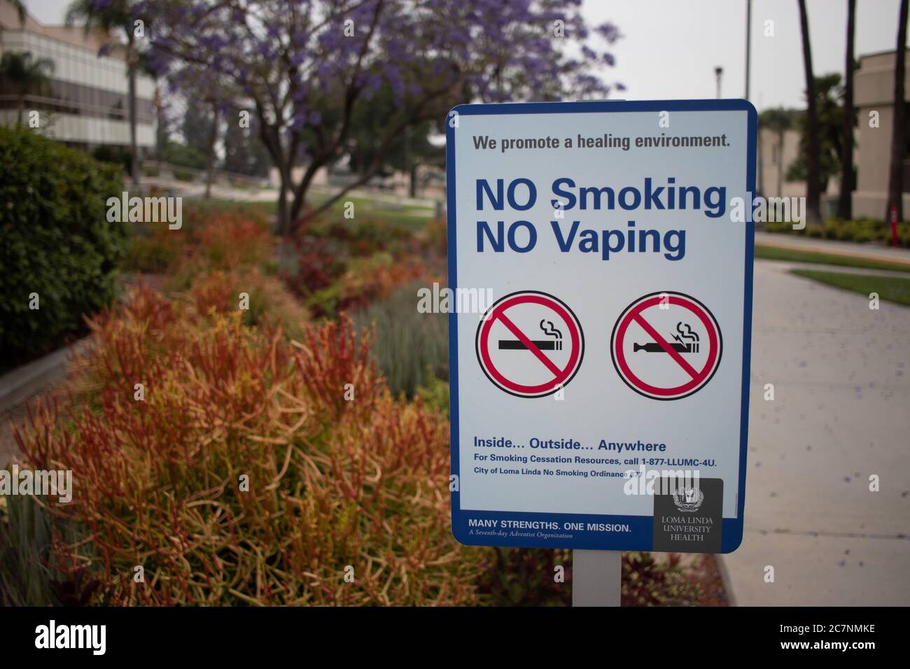 LOMA LINDA, UNITED STATES - May 29, 2020: Warning sign in Loma Linda,  California advising visitors about rules prohibiting both cigarette smoking  and Stock Photo