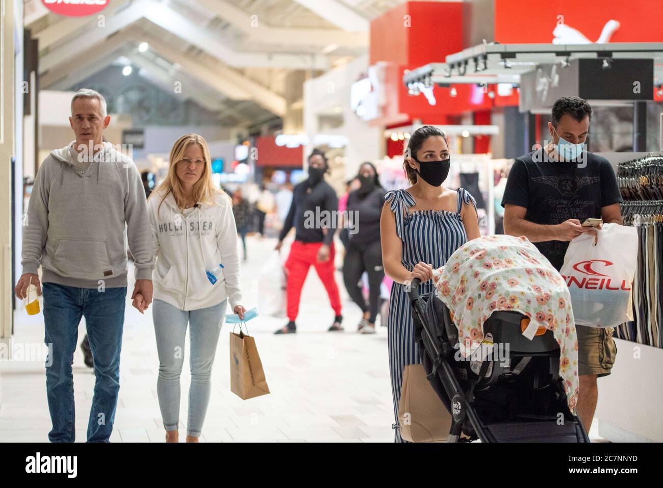 Sunrise, Florida, USA. 18th July, 2020. People shop at Sawgrass Mills Mall in Florida despite record high number of new Covid-19 cases in the state this week Credit: Orit Ben-Ezzer/ZUMA Wire/Alamy Live News Stock Photo