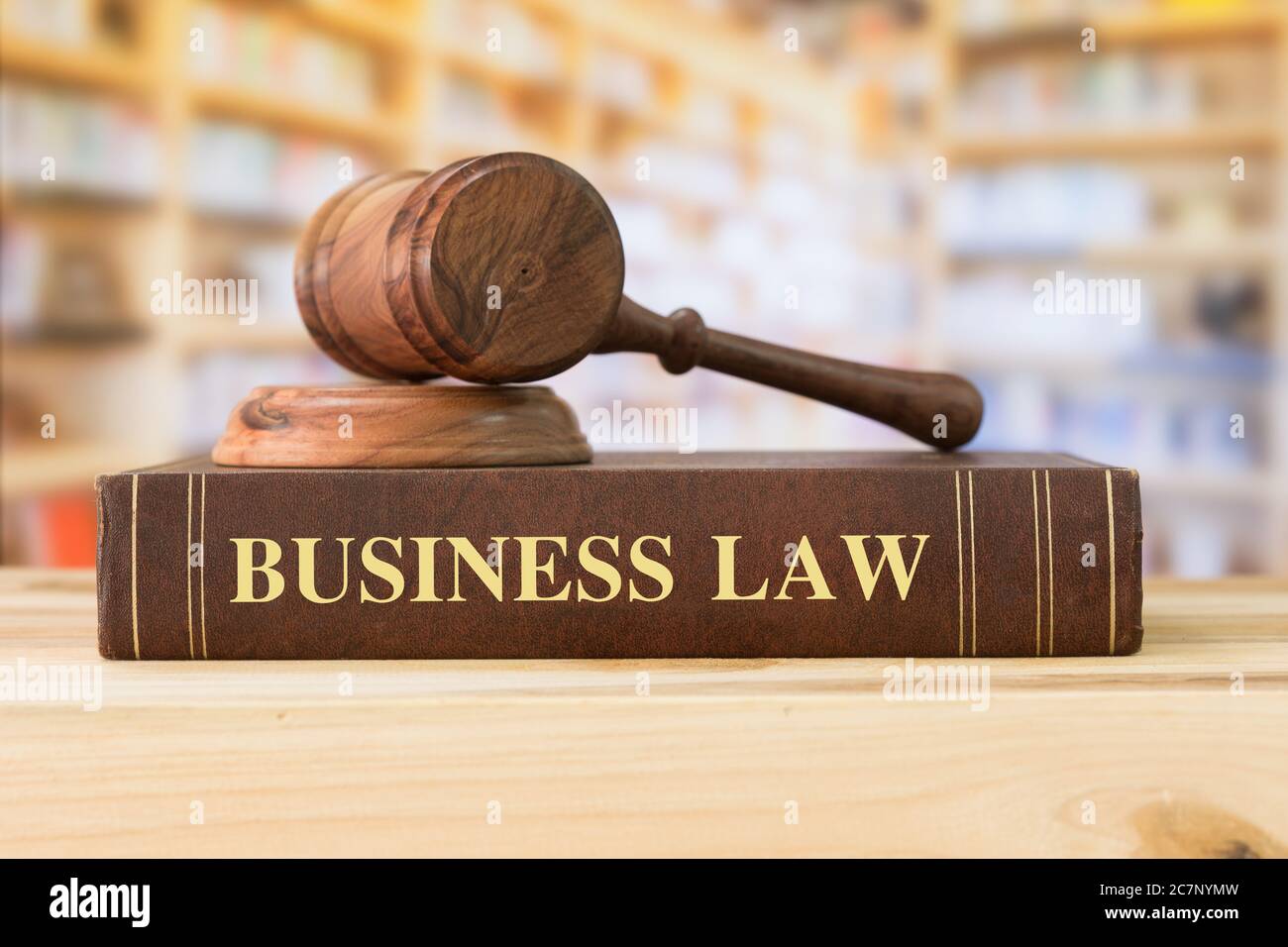 Business Law books with a judges gavel on desk in the library. Law education ,law books concept. Stock Photo