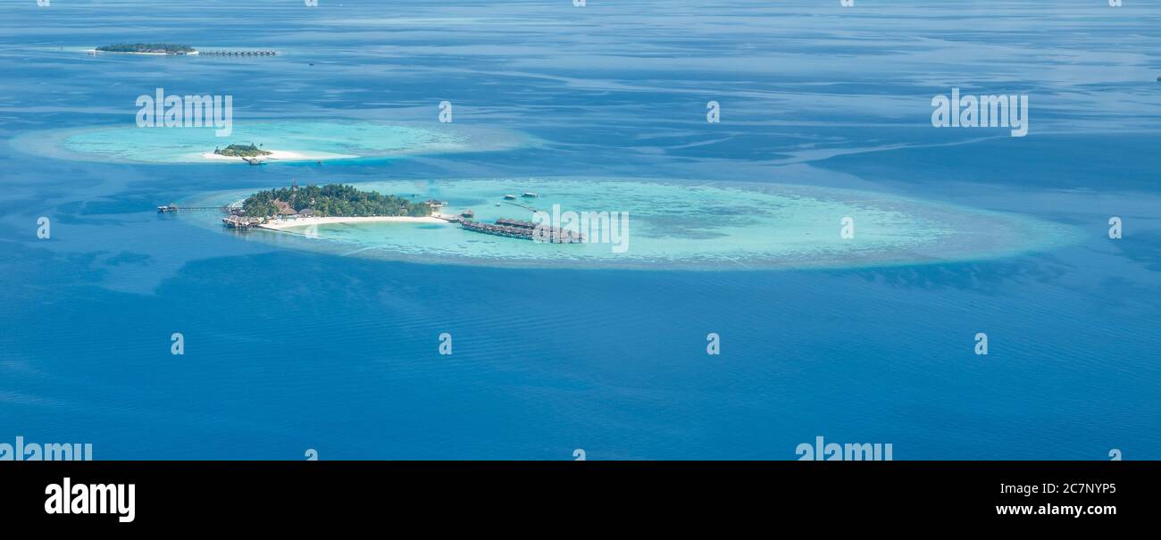 Tropical islands and atolls in Maldives from aerial view Stock Photo