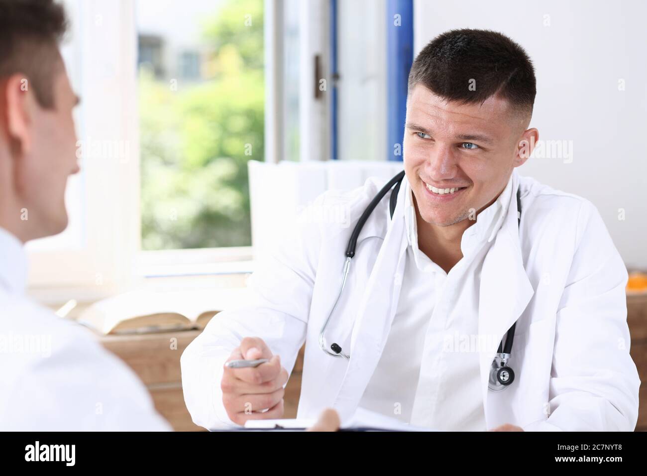 Doctor handsome man show hi-res stock photography and images - Alamy