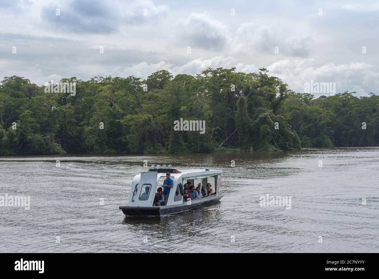 tourist boat with unidentified people visiting Tortuguero National Park, Costa Rica Stock Photo