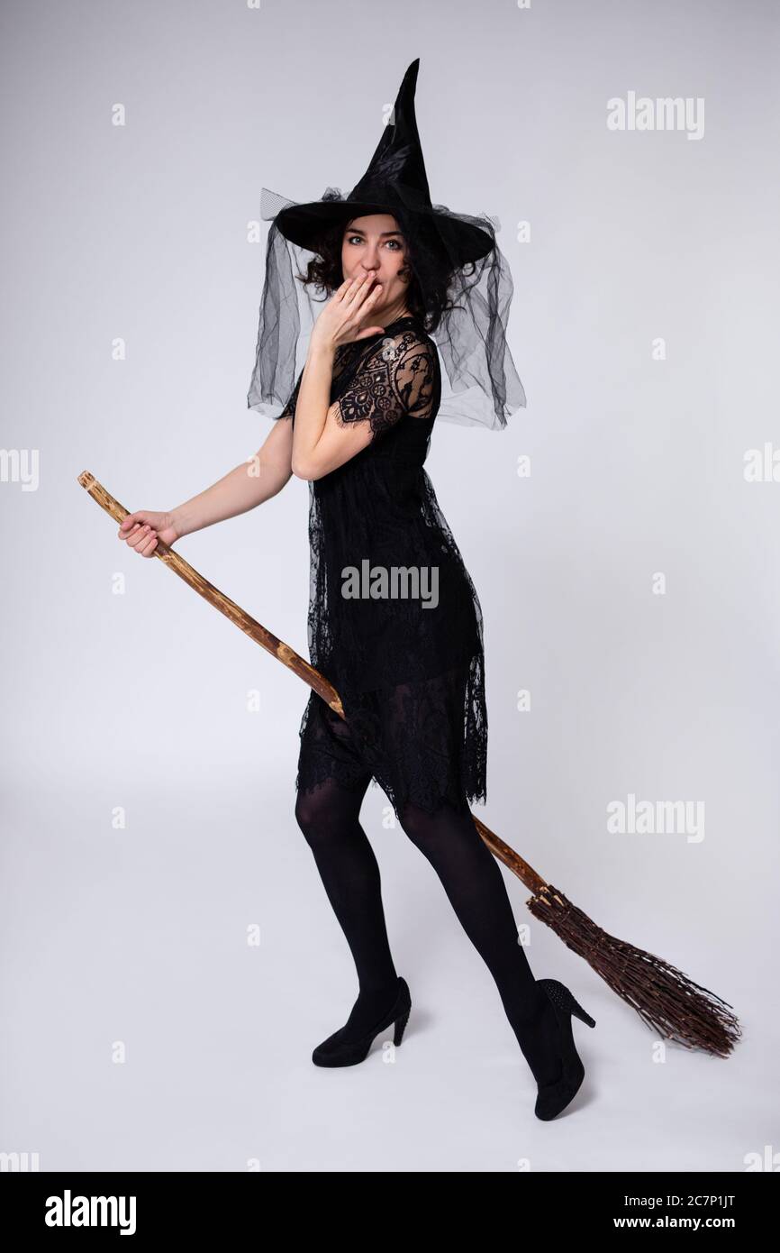 halloween concept - full length portrait of surprised beautiful woman ...