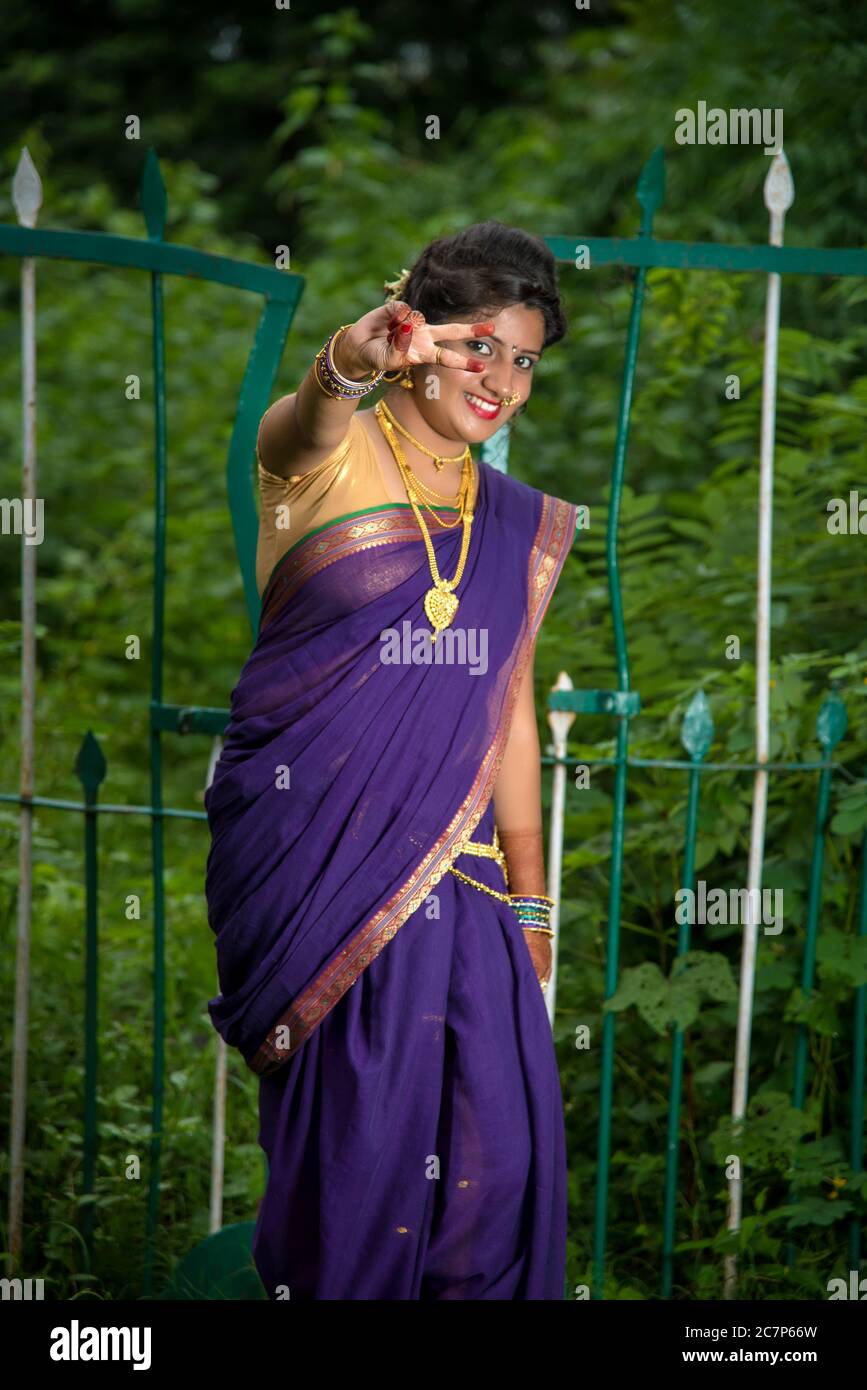 Beautiful Indian young girl in Traditional Saree posing outdoors 5050764  Stock Photo at Vecteezy