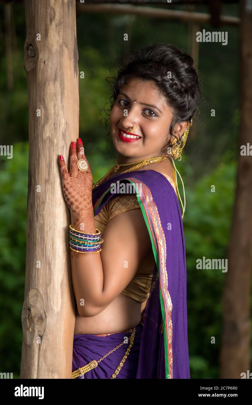 Image of Indian traditional Beautiful Woman Wearing an traditional Saree  And Posing On The Outdoor With a Smile Face-CK720291-Picxy