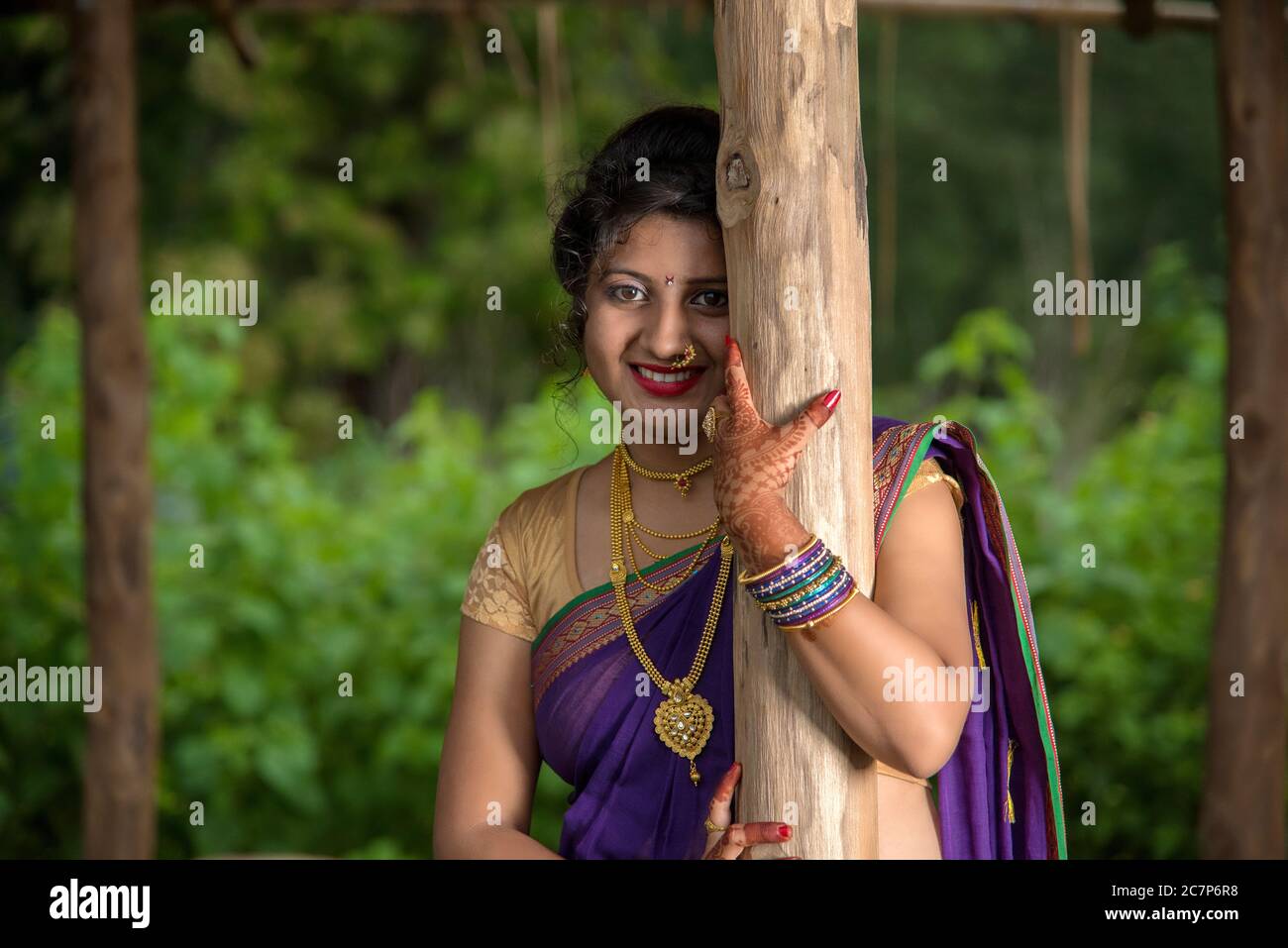Beautiful Indian young girl in Traditional Saree posing outdoors Stock ...