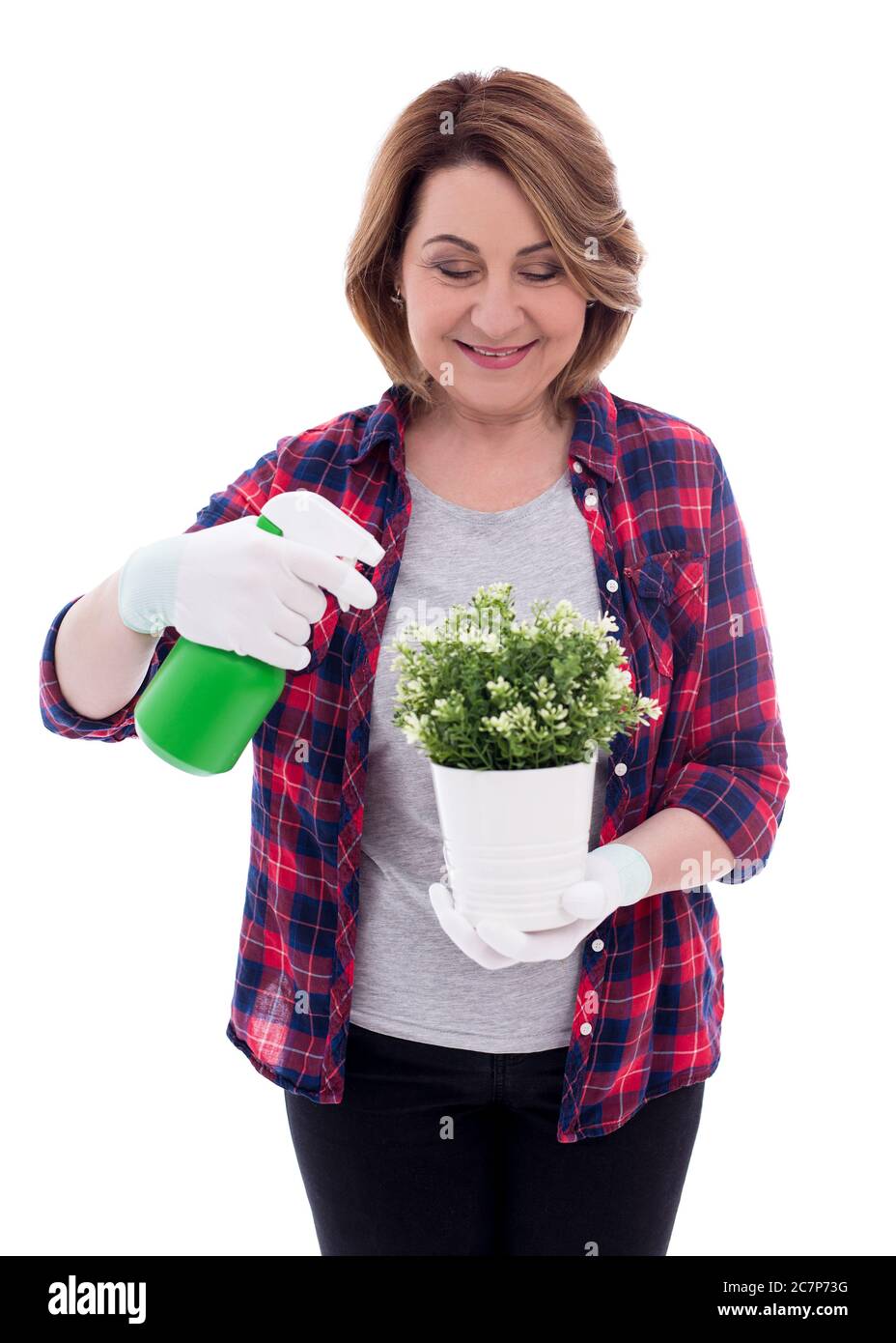 portrait of smiling mature woman gardener with potted plant and ...