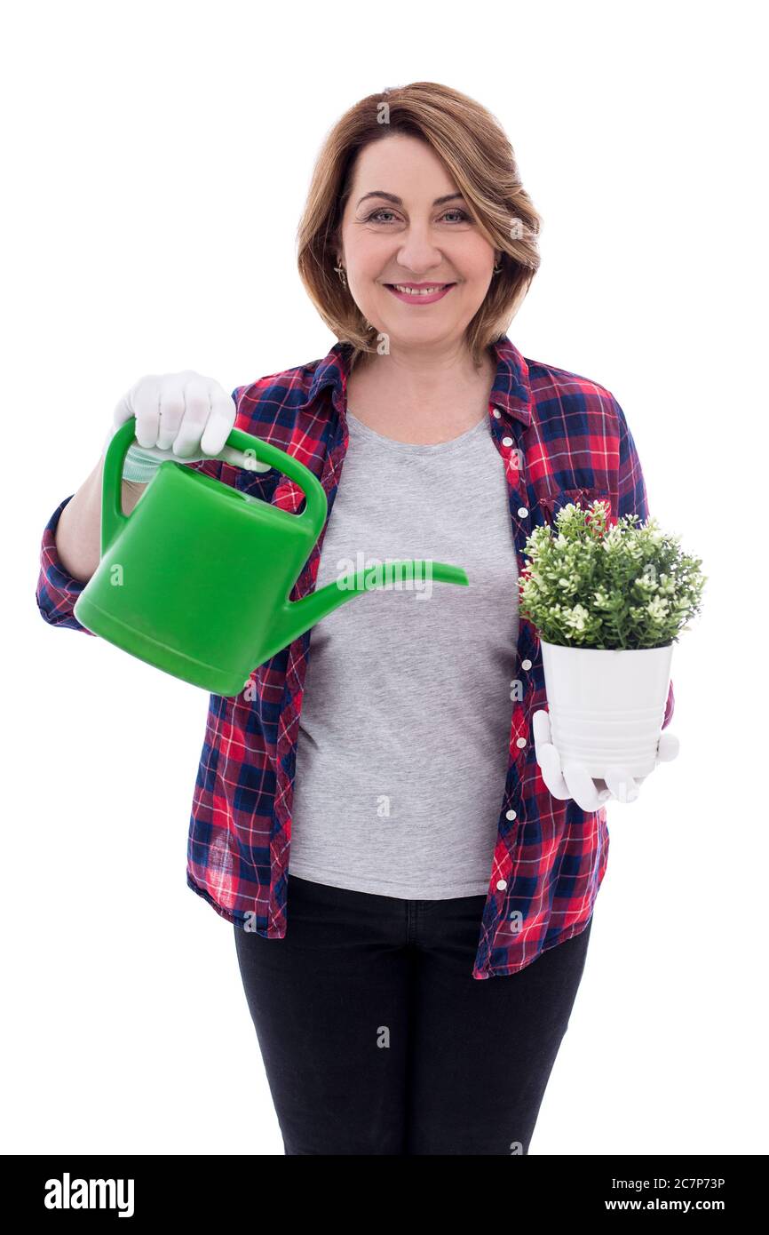 portrait of smiling middle aged woman gardener with potted plant and ...