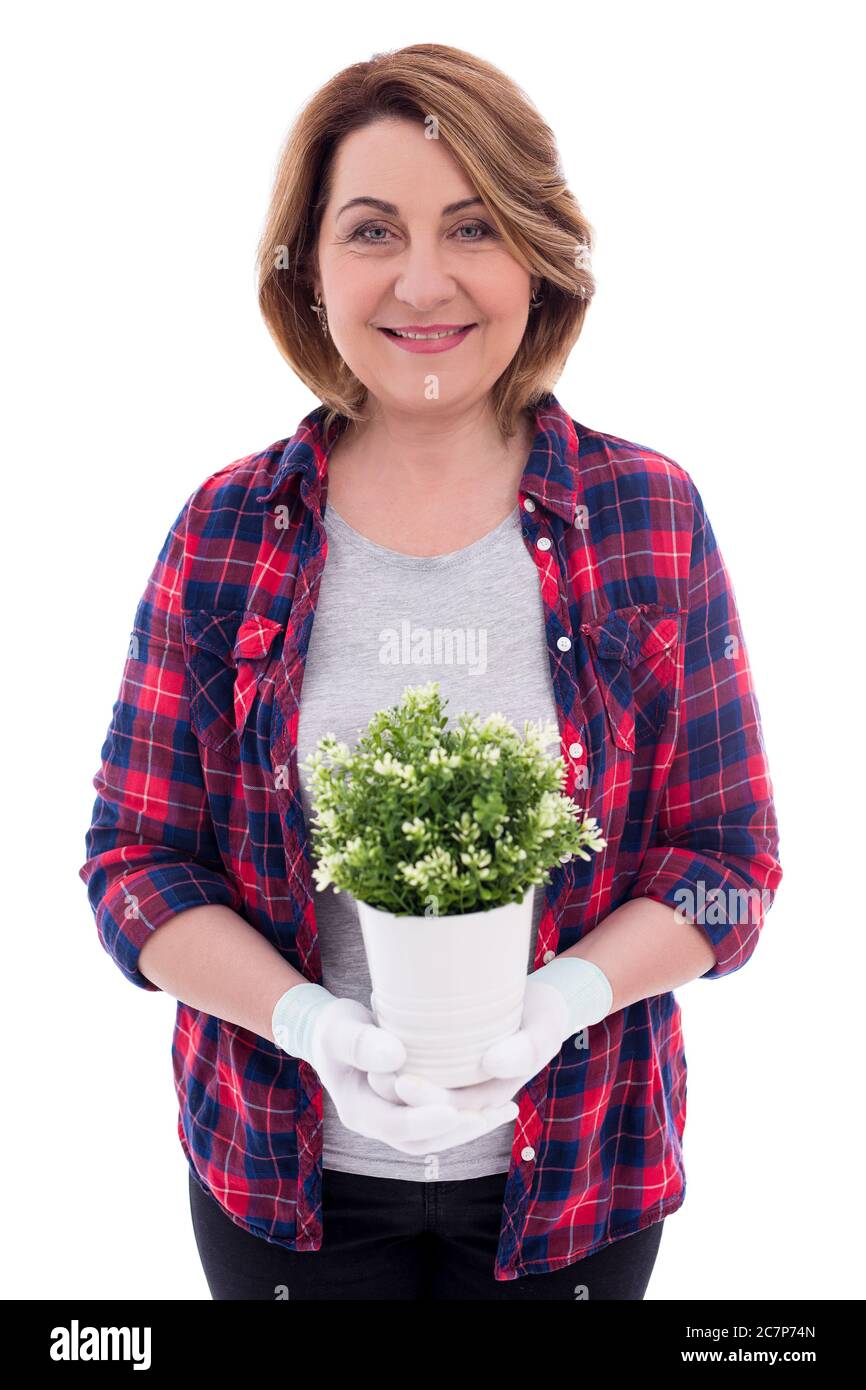 portrait of smiling mature woman gardener with potted plant isolated on ...