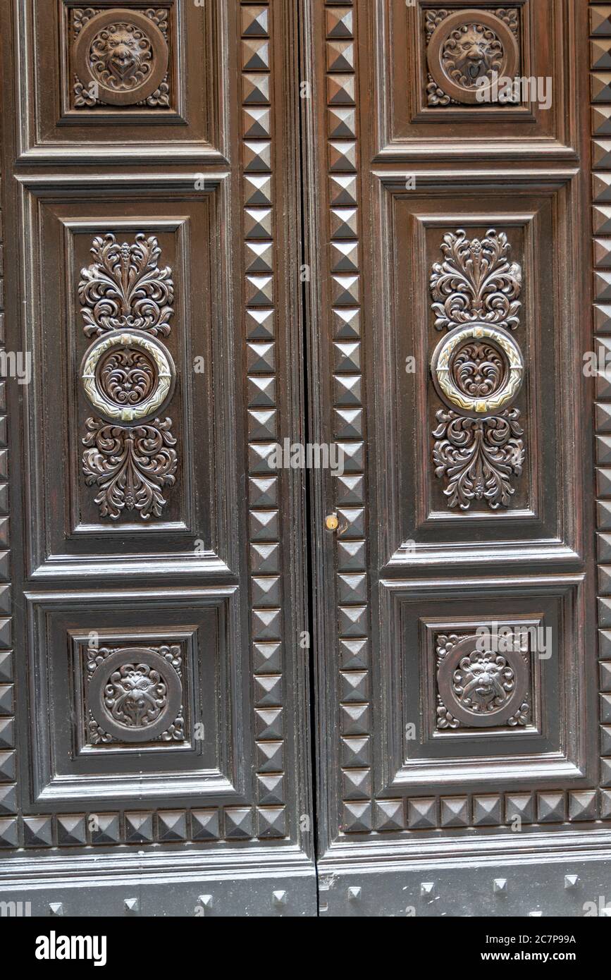 armored door with wooden cover with two doors Stock Photo Alamy
