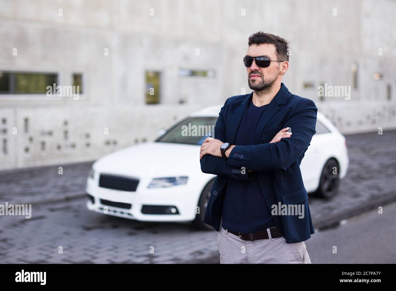 handsome business man posing with his white car Stock Photo - Alamy