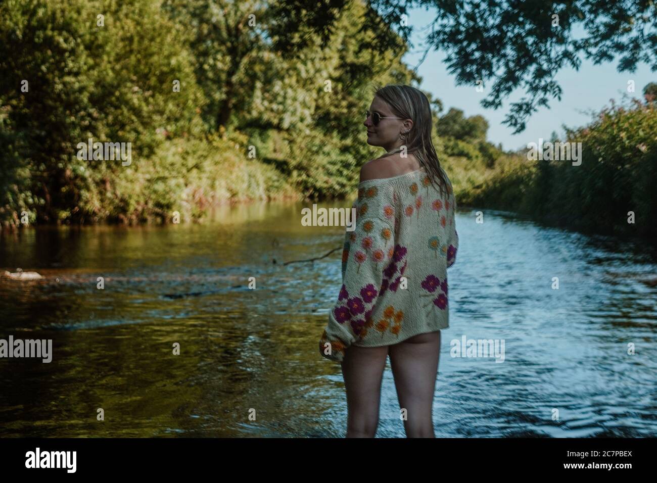 Beautiful woman skinny dipping and wild swimming in river Stock Photo -  Alamy