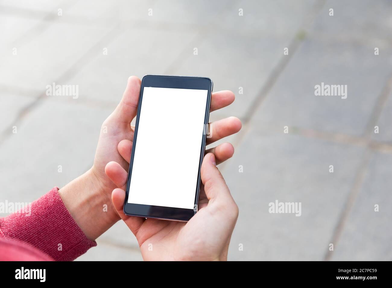 Man uses red smartphone close hi-res stock photography and images - Alamy