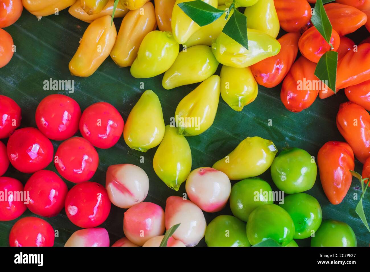 Colorful Traditional Thai desserts, called 'Luk Chup', one of the famous Thai desserts made from beans, coconut, and jelly. Stock Photo