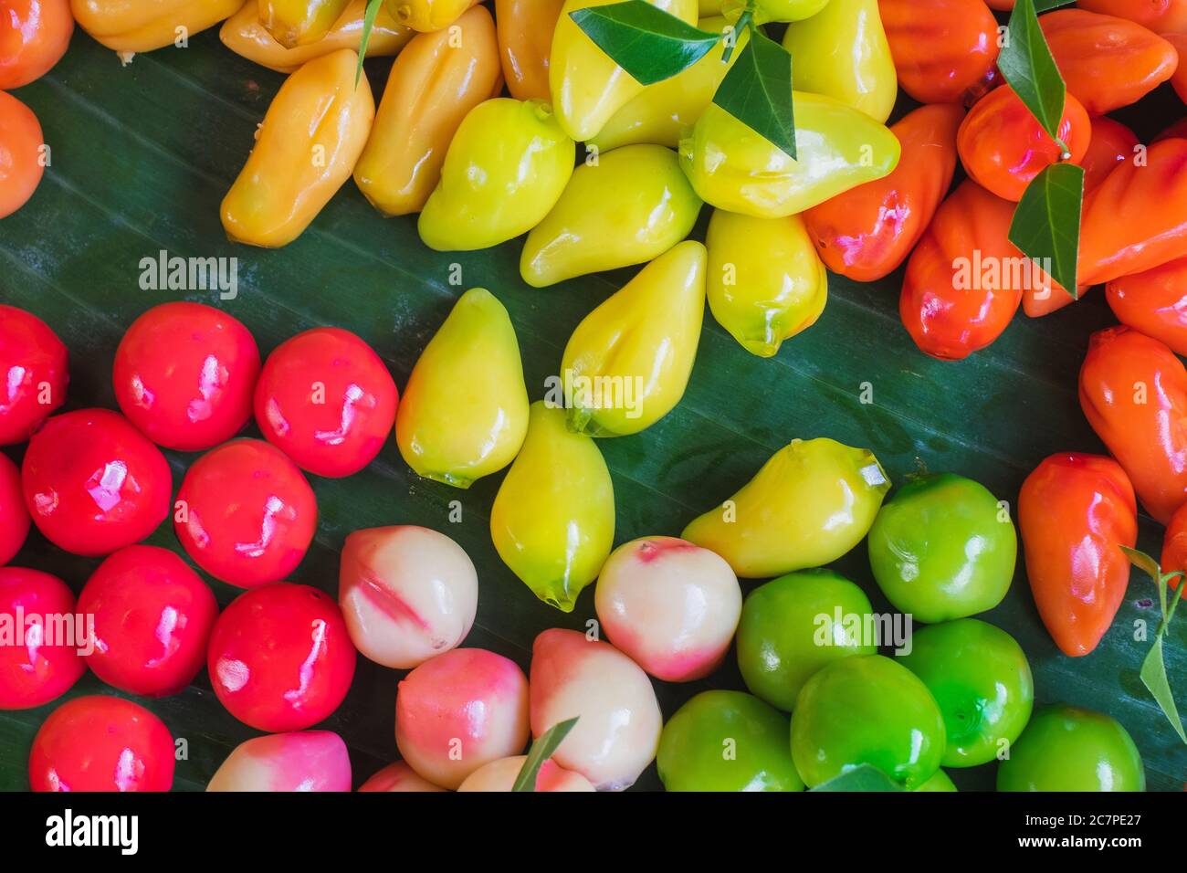 Colorful Traditional Thai desserts, called "Luk Chup", one of the famous Thai desserts made from beans, coconut, and jelly. Stock Photo