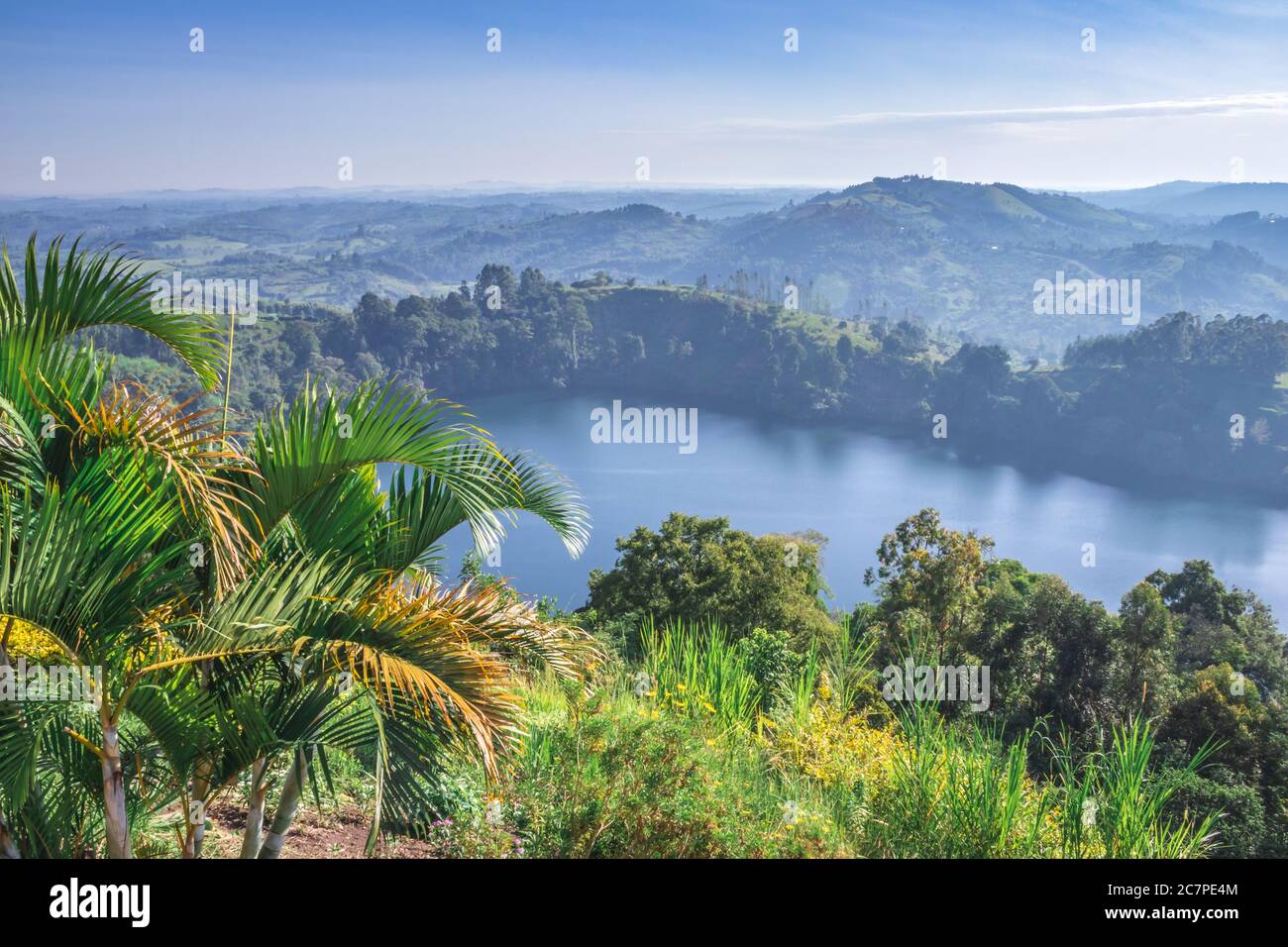 View of a landscape with green mountains and a Crater Lake and the reflections on the water View of a landscape with green mountains and a Crater Lake and the reflections on the water
