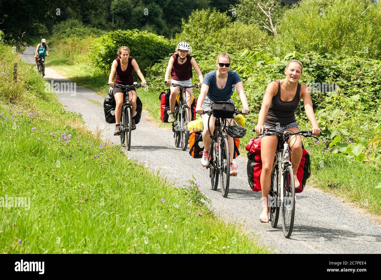 Women People enjoy vacation riding bike on the cycle path Europe, the road on Elberadweg Saxony cycling Germany holiday women riding bicycles together Stock Photo