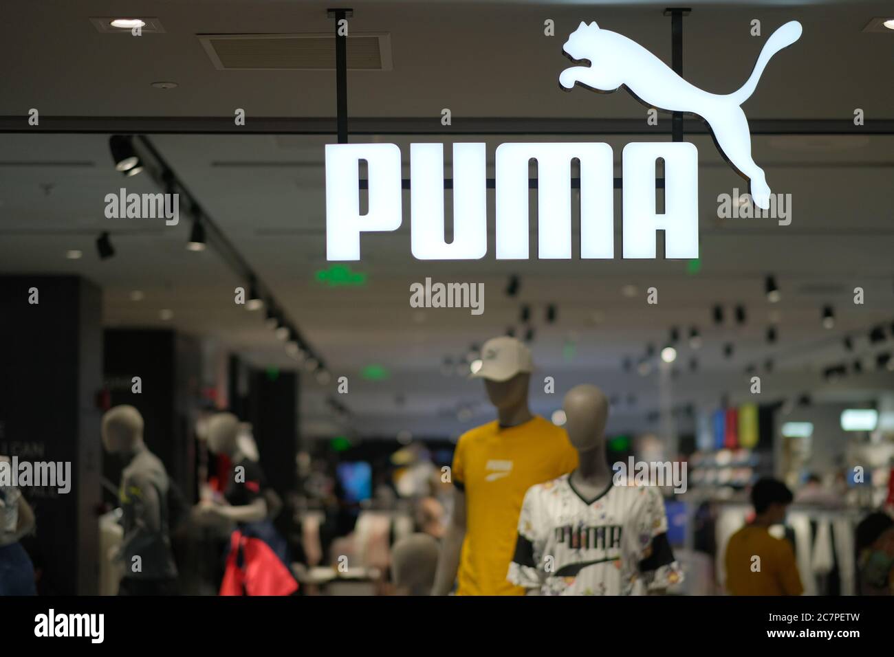 close up PUMA's shop sign hanging in store. Blur background. German sports brand Stock Photo