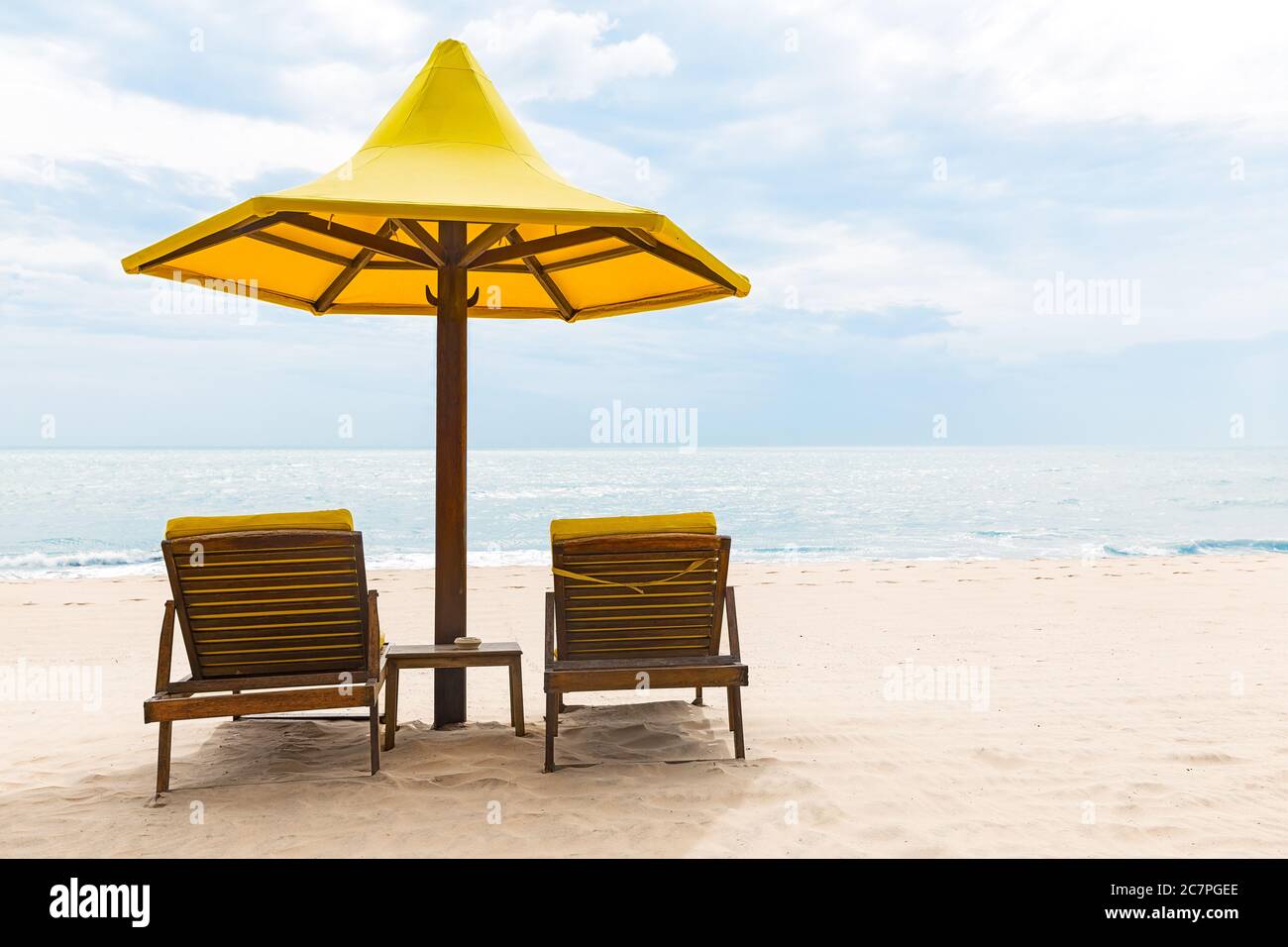 Beach chairs with umbrella and beautiful sand beach Stock Photo Alamy