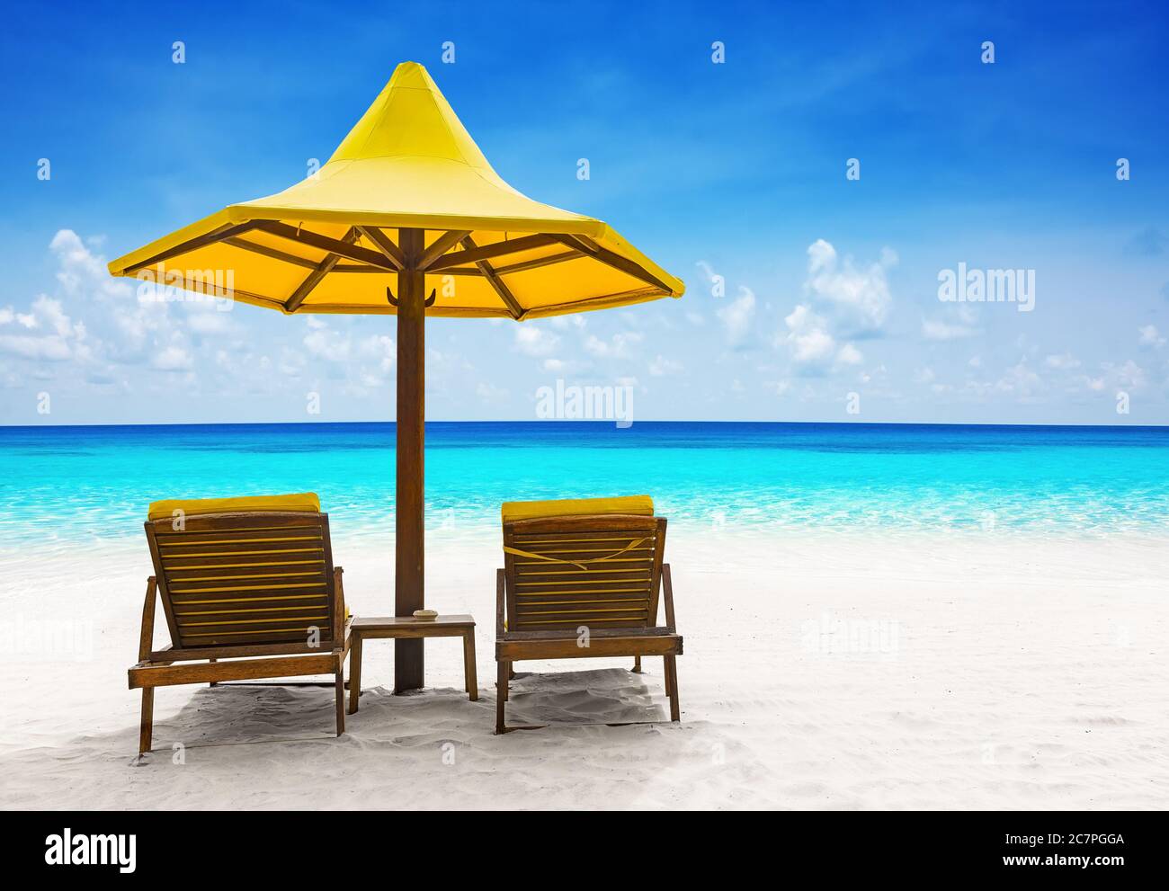 Beach chairs with umbrella and beautiful sand beach Stock Photo Alamy